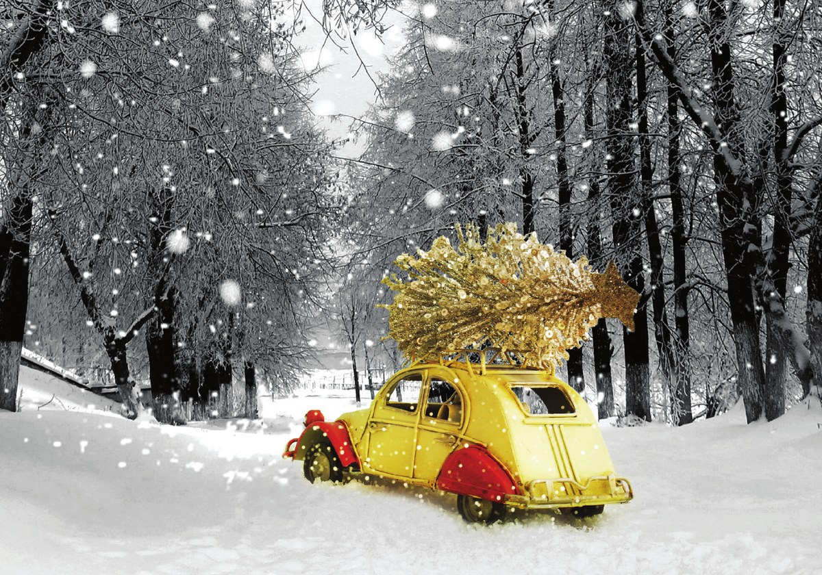 Christmas card with a yellow car carrying a golden tree through the snow